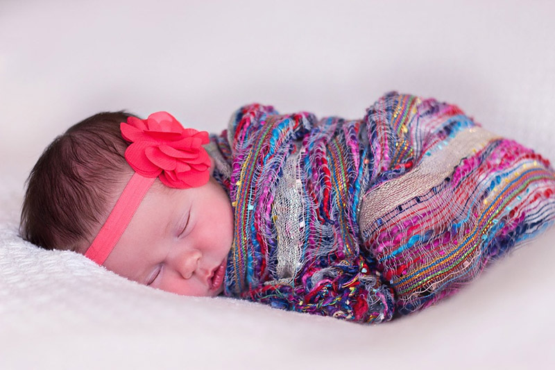 Baby sleeps on a mattress